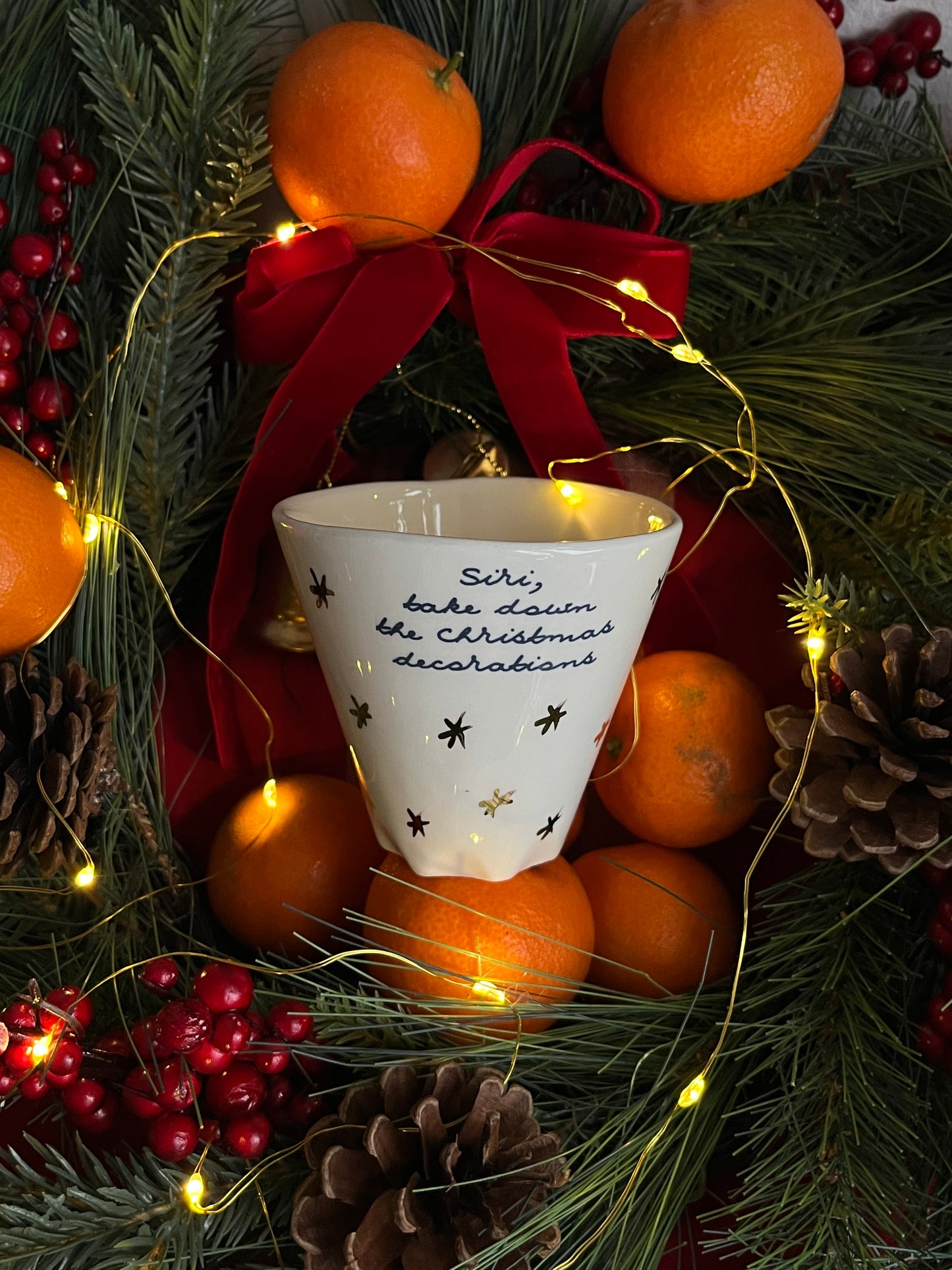 Cup Siri take down Xmas decorations