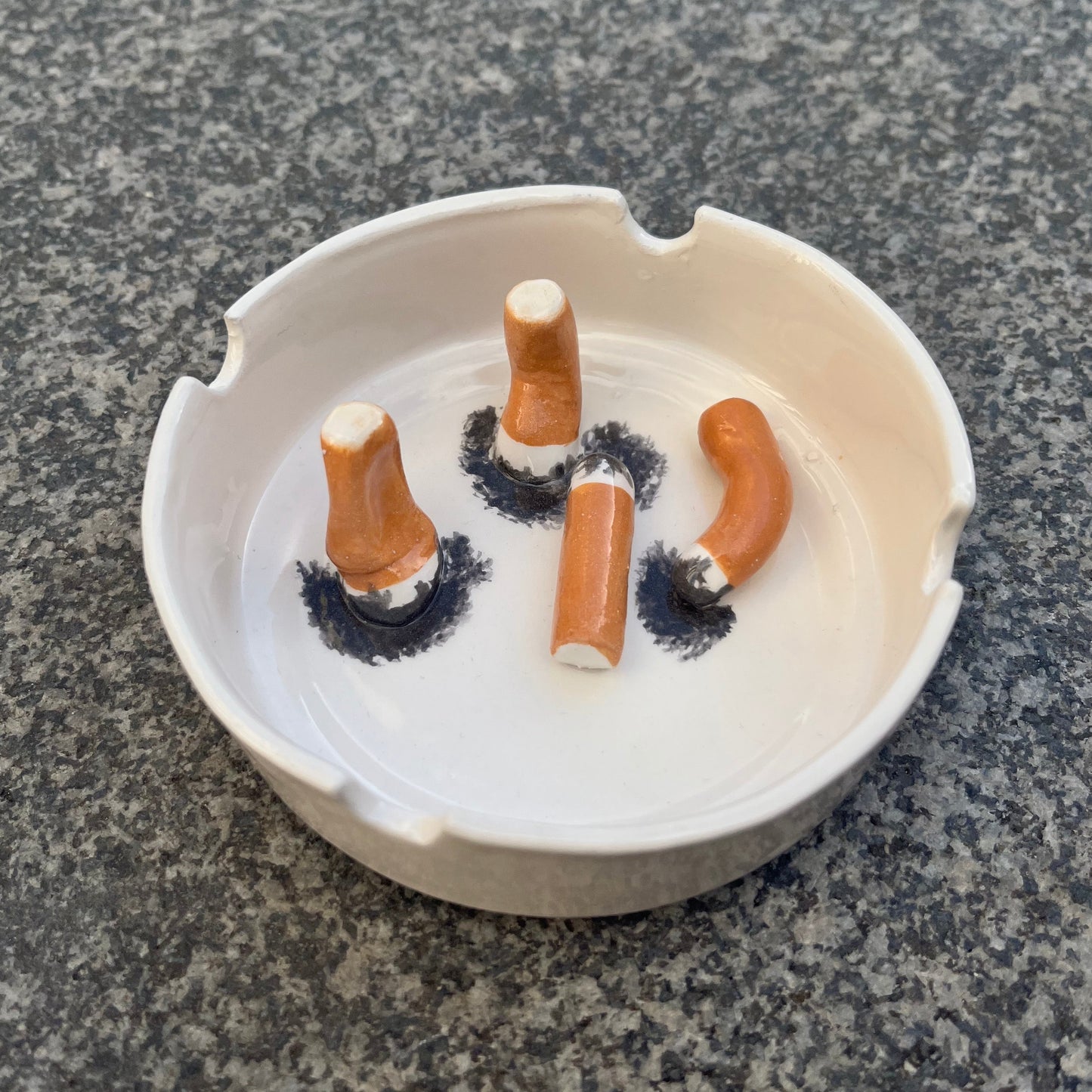 Ashtray/accessory holder full of cigarettes #2