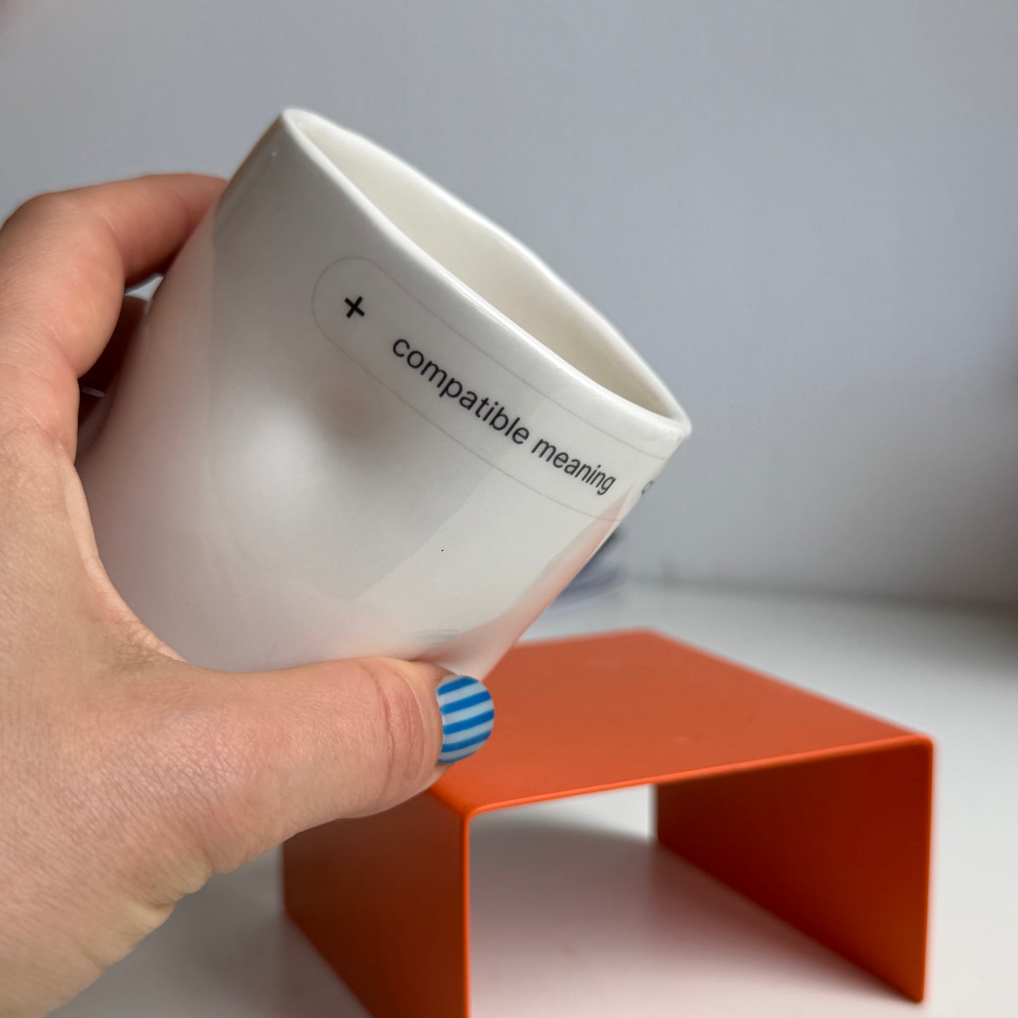 Heated crumpled cup Compatible meaning